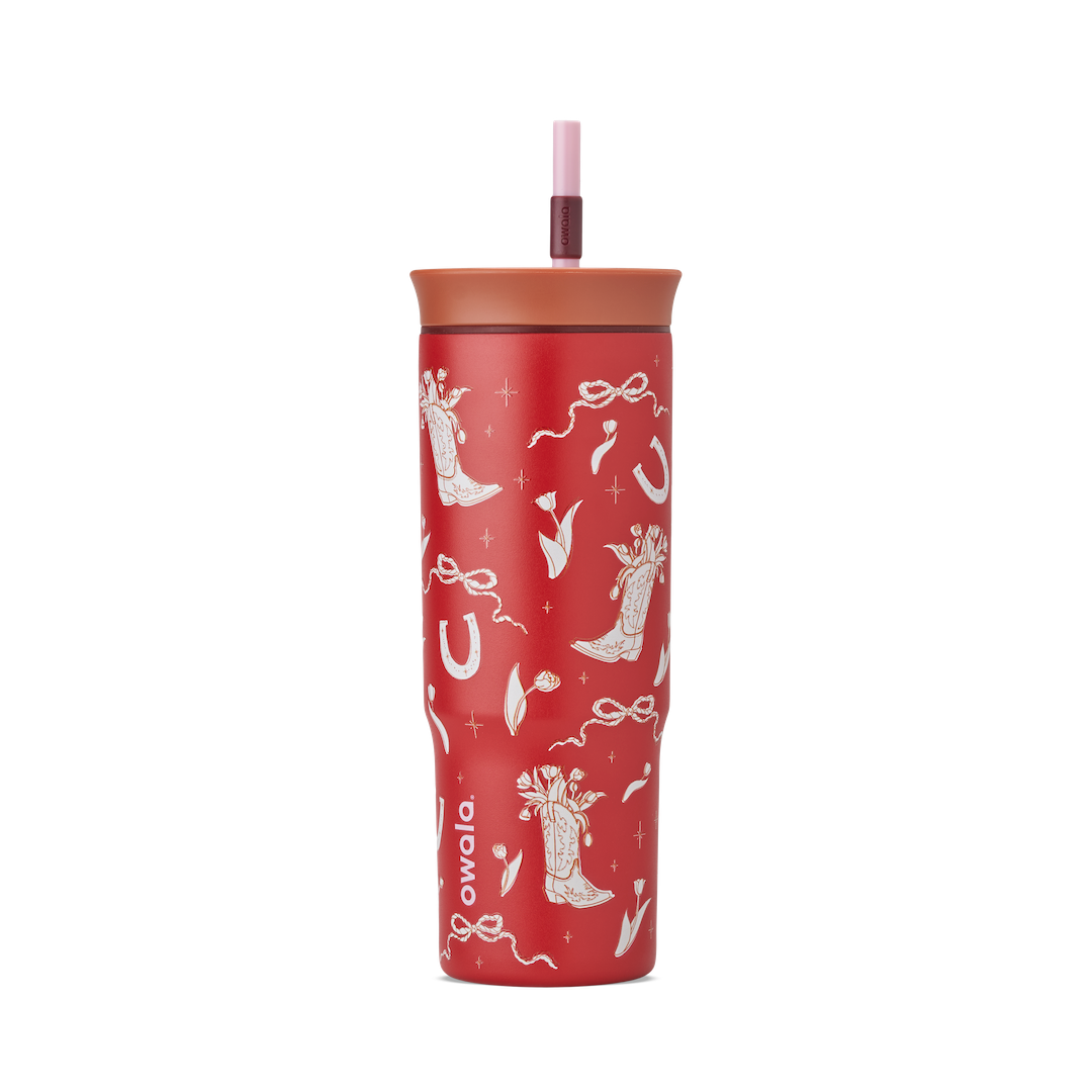 Owala Birthday Bash Marlu Giddy Up 24oz Tumbler in deep red with cream illustrated cowboy boots, horseshoes, ribbons, and stars, terracotta lid, and pink straw