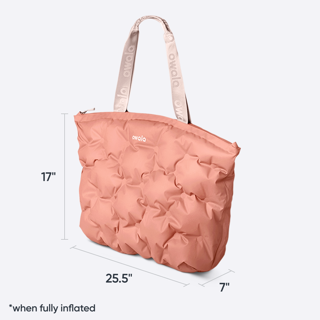 Owala Cloud tote in Rosewood, coral pink puffer-quilted body with blush owala-tape handles, with size dimensions 17 inches tall by 25.5 inches wide by 7 inches deep "when fully inflated"