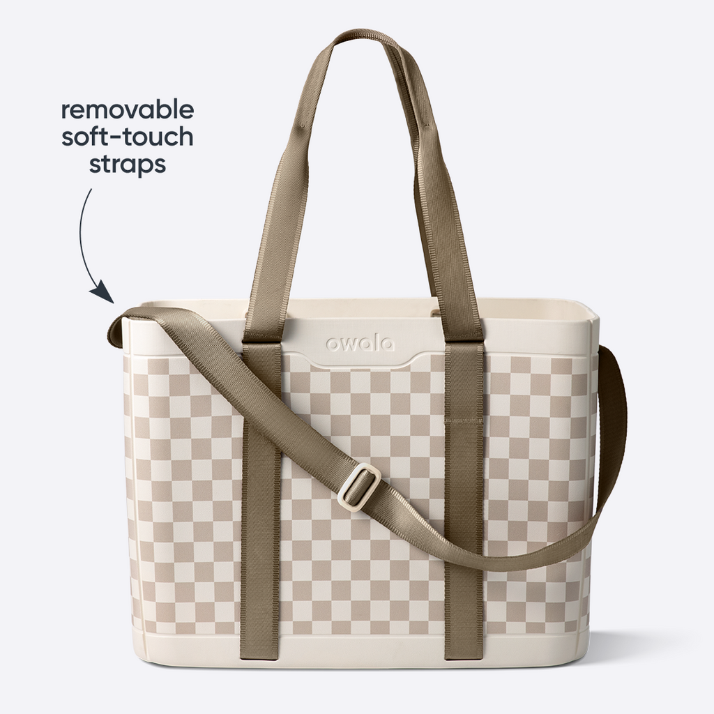 Owala Sun-Day Collapsible Tote in Checkin' In, cream and tan checker body with olive removable soft-touch straps including shoulder strap, with text overlay reading "removable soft-touch straps"