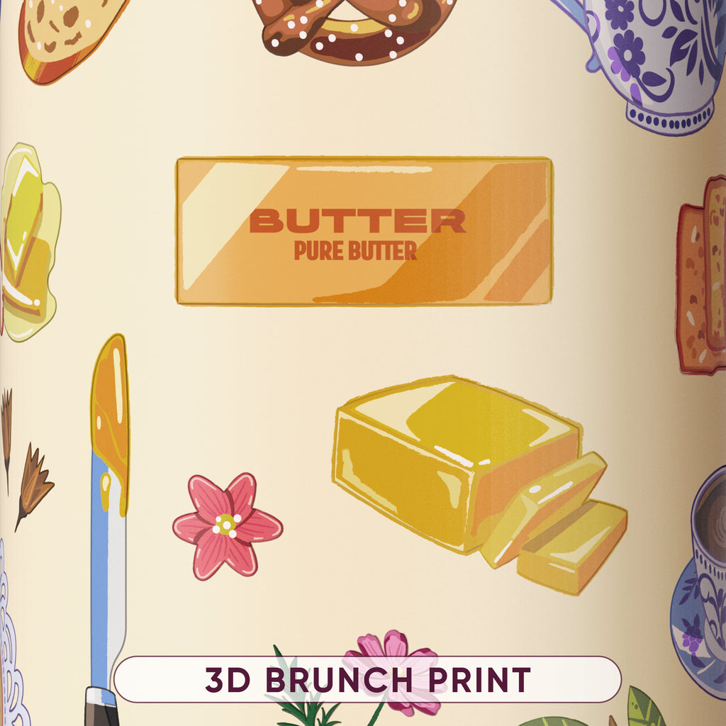 Close-up of the Brunch Bunch 3D brunch print pattern showing illustrations of butter, bread, pretzels, flowers, and teacups on a cream background
