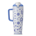 Heirloom 40oz Tumbler with handle; white body with blue delft-style illustrated pattern of stars, flowers, and charms; periwinkle blue handle and lid