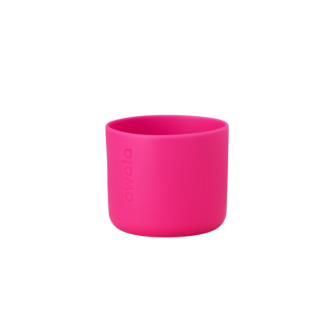 Owala Bottle Boot in vivid hot pink silicone with tonal Owala logo, short cylindrical form sized for 16oz Kids' FreeSip bottles