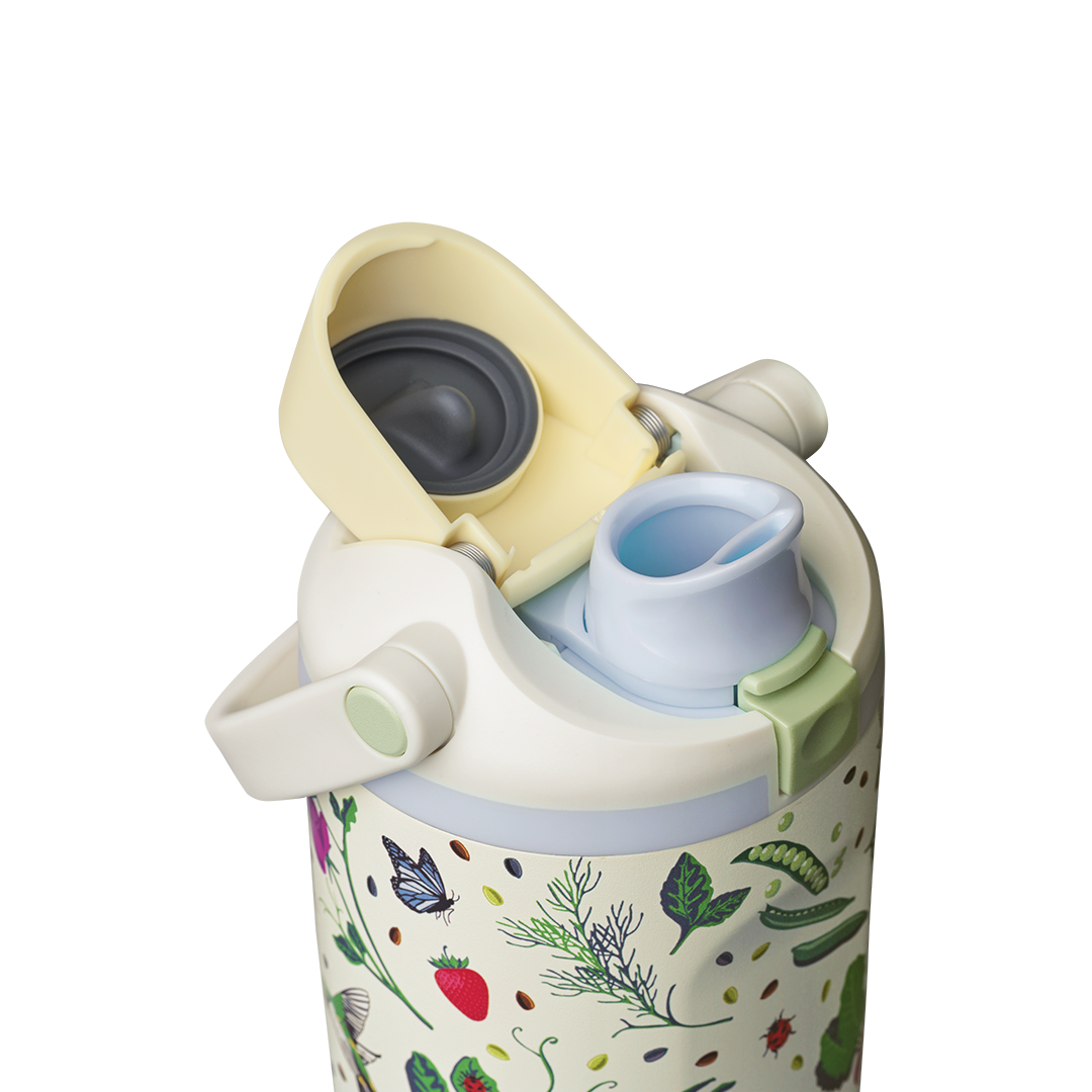 Owala FreeSip Sway 30oz, cream body with garden-themed pattern, butter yellow flip cap open exposing light blue FreeSip spout