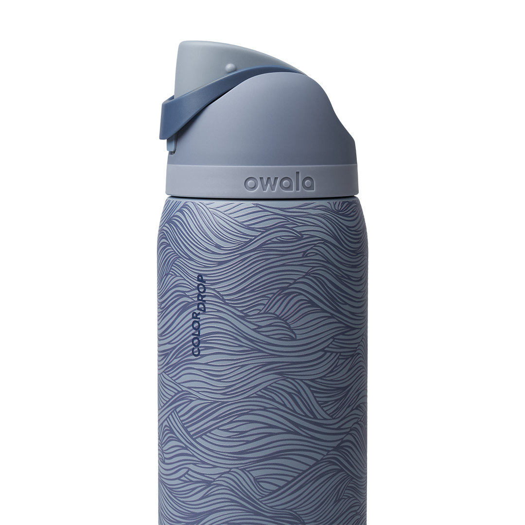 Owala FreeSip 32oz, slate blue body with embossed wave texture, matching slate blue lid and flip cap