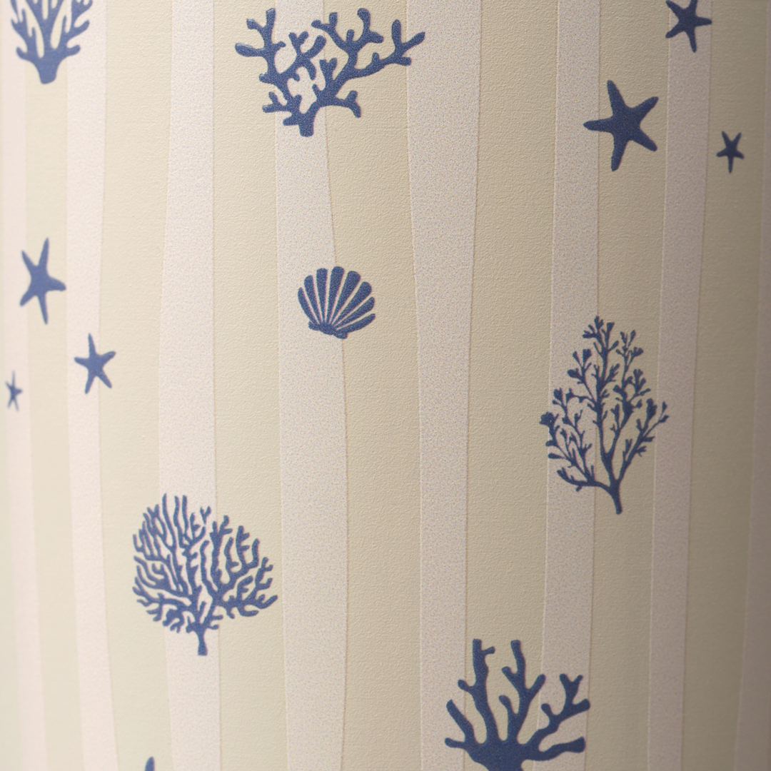 Owala FreeSip Tumbler 30oz in Coral Cabana, close-up of cream body with vertical stripes and navy coral, starfish, and seashell illustrations