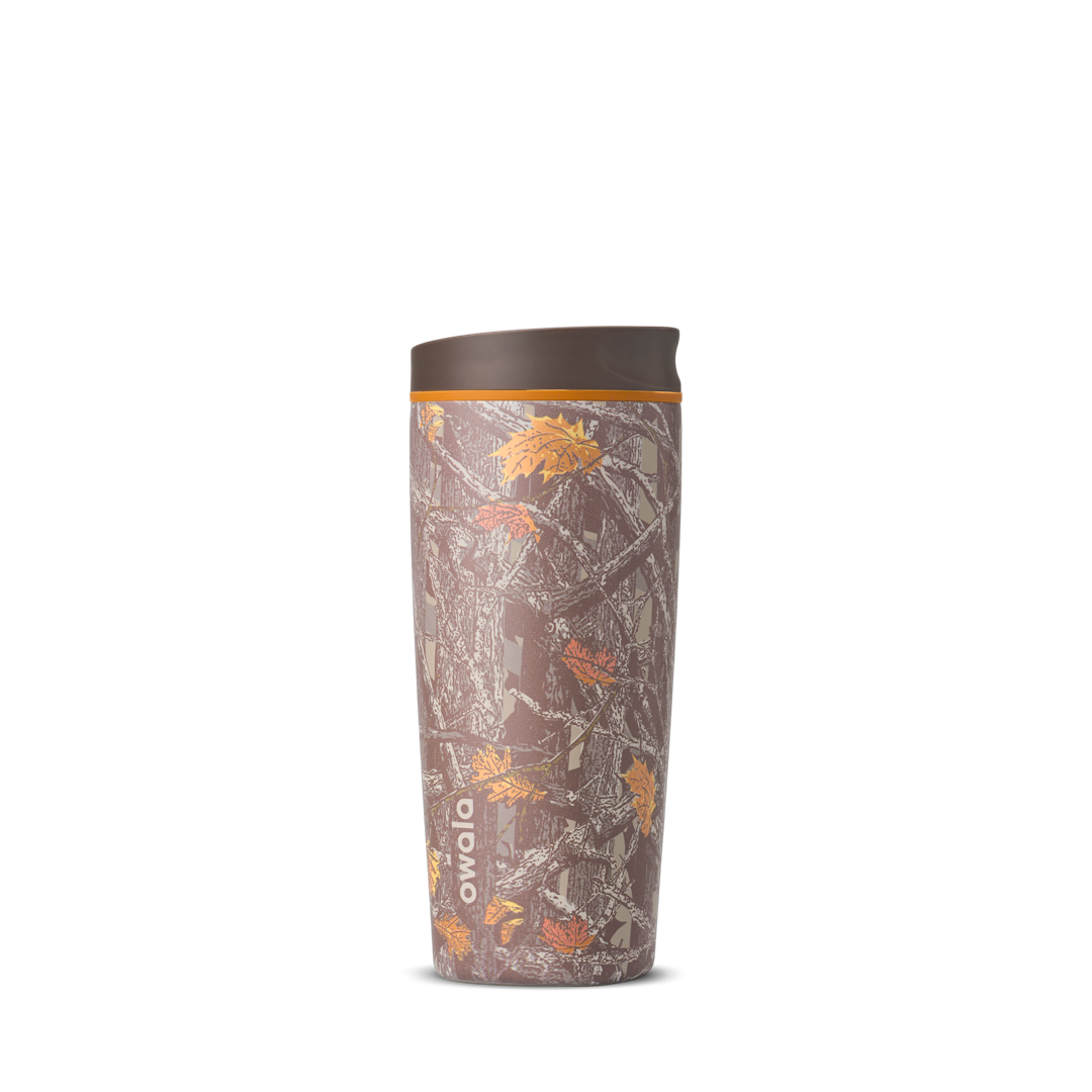 SmoothSip Slider 20oz in Out of Sight, brown forest Mossy Oak camouflage print with leaves and branches across the body, brown lid, and orange accent ring