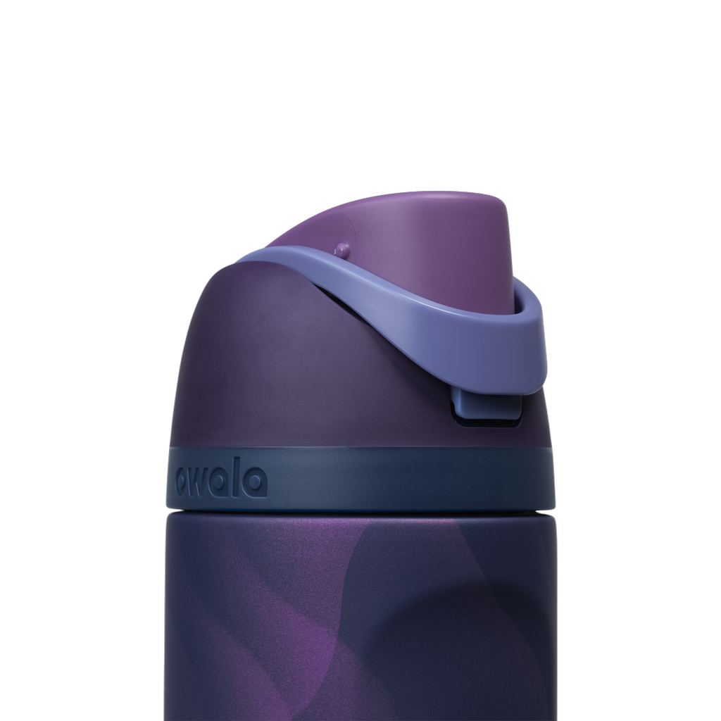 Owala FreeSip 24oz in Arctic Storm, close-up of the navy lid with deep purple flip cap and periwinkle carry loop folded over the top