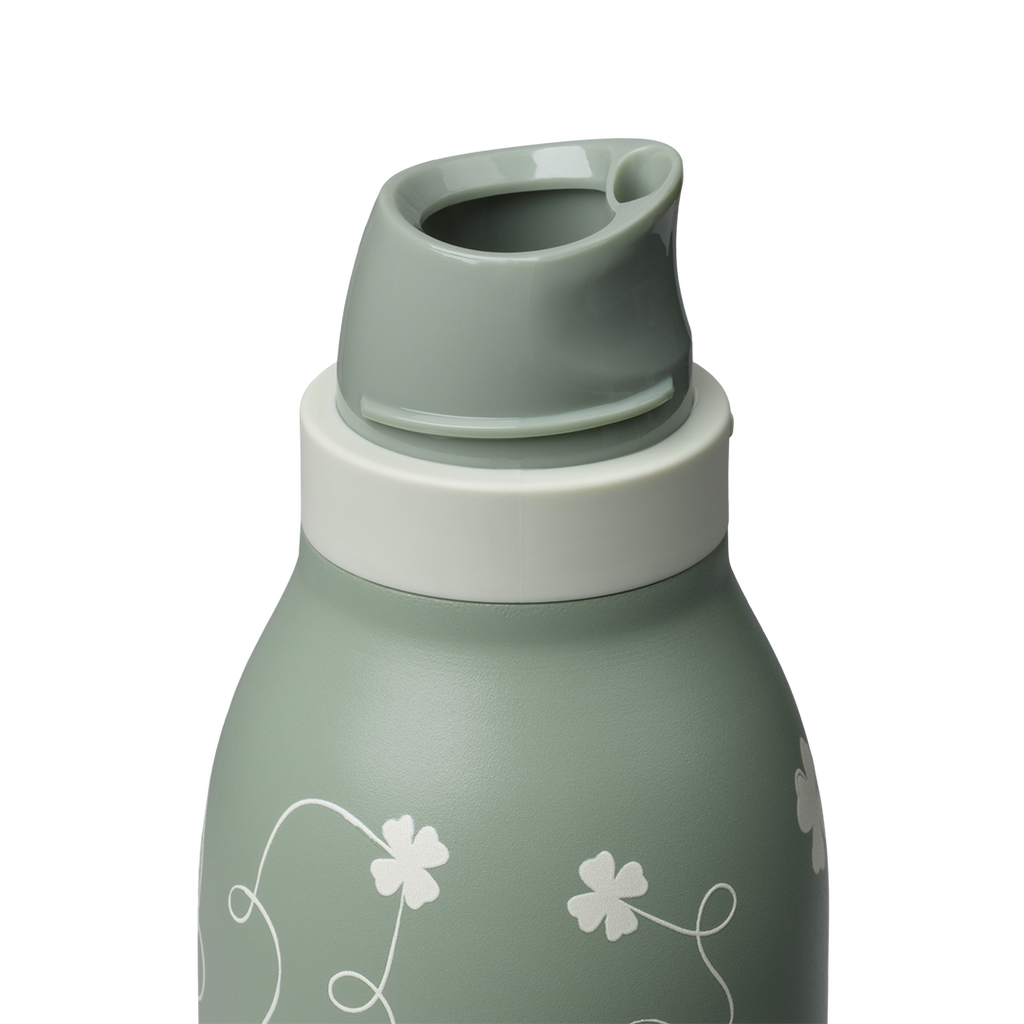 Owala FreeSip Twist 24oz, sage green body with white clover pattern, twist cap removed showing sage green FreeSip spout