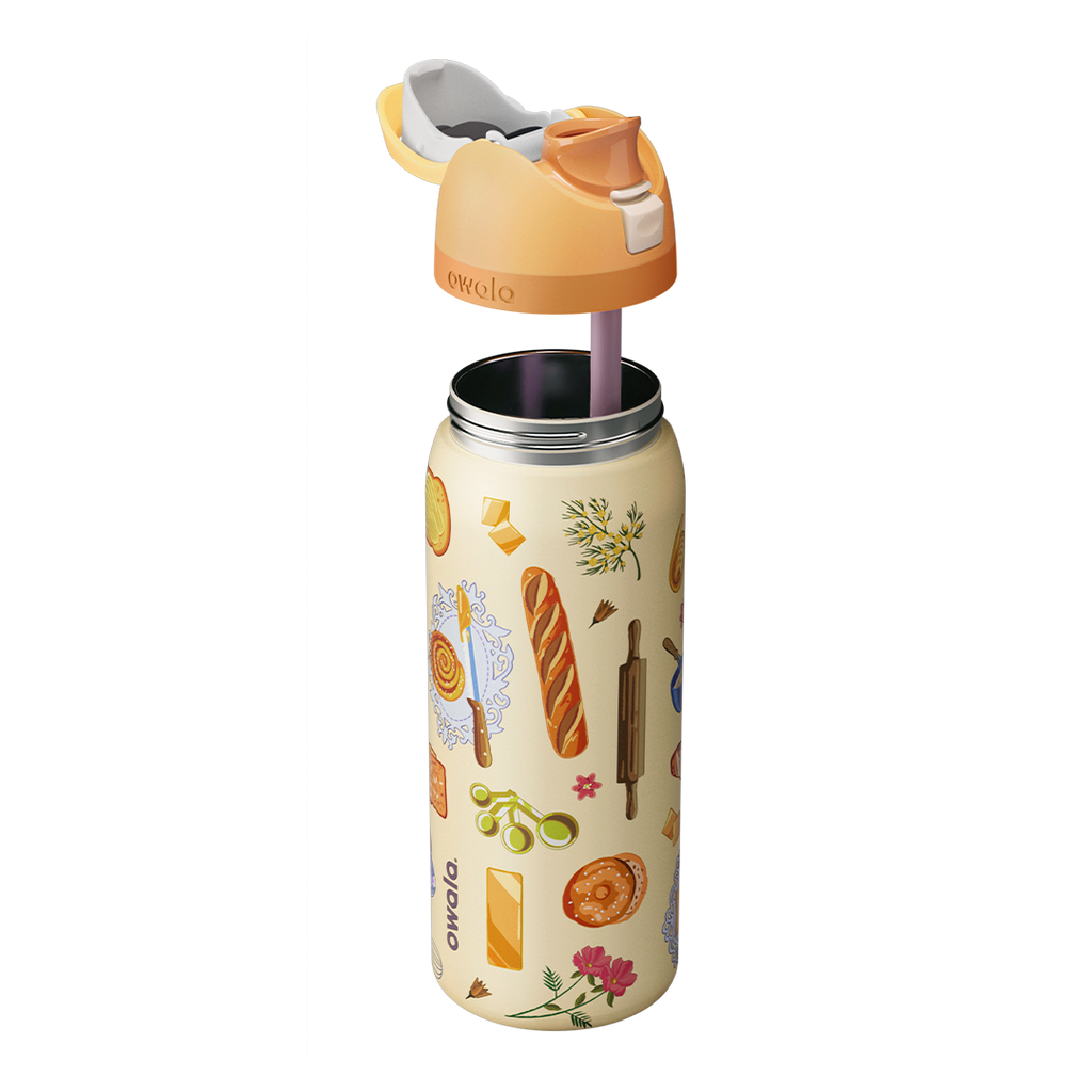 Owala FreeSip 32oz in Brunch Bunch, exploded view showing the cream patterned body, peach lid with cream carry loop, and pink silicone straw